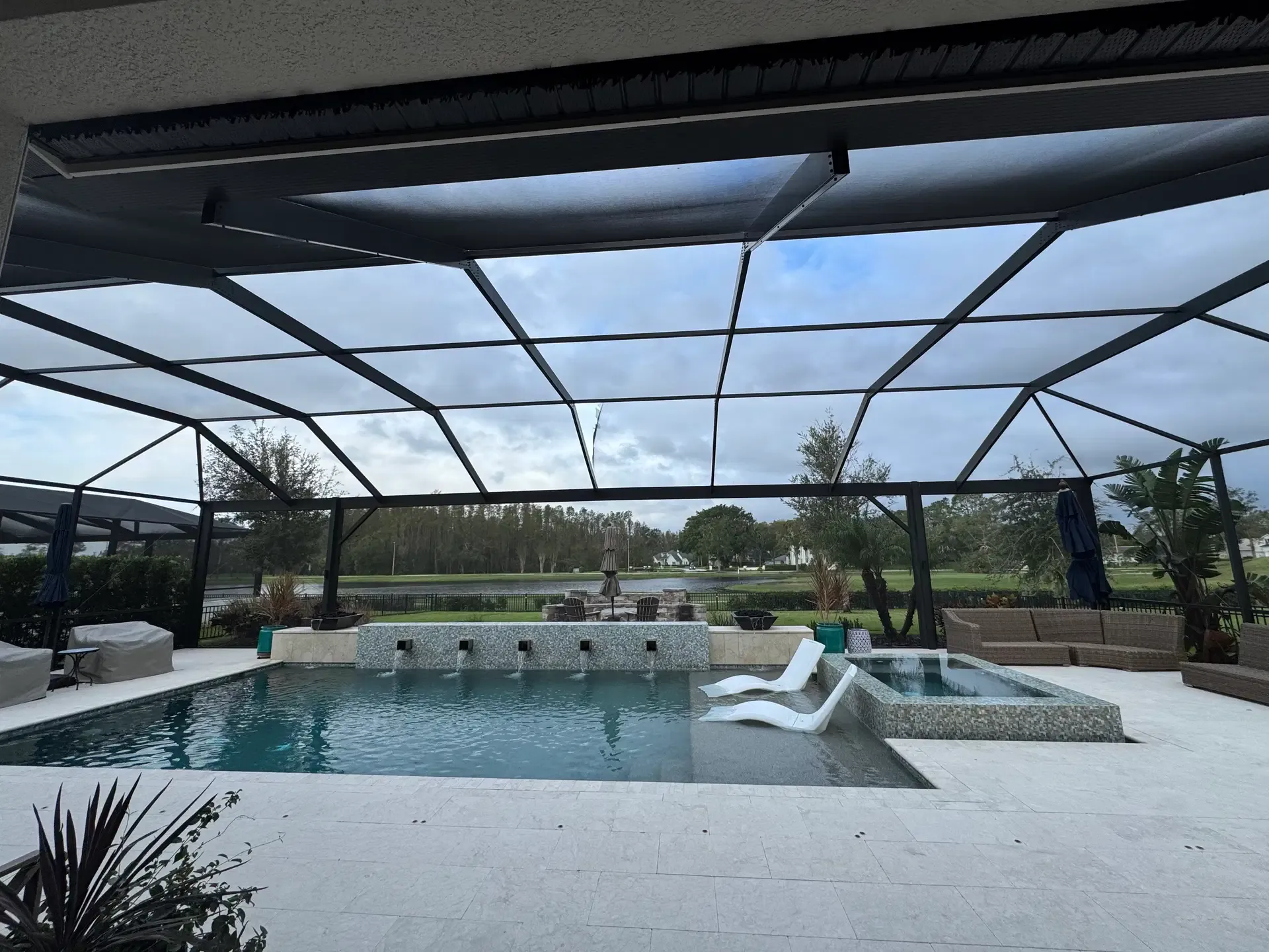 Torn screen panel at a Cheval pool enclosure before repair.
